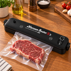 Selladora al vacío automática negra sellando una bolsa con carne